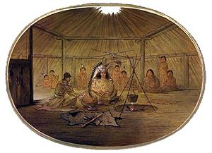 Interior of a Mandan lodge by George Catlin showing the four pillars supporting the roof and the smoke hole.