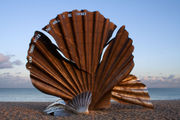 The Scallop by Maggi Hambling is a sculpture dedicated to Benjamin Britten on the beach at Aldeburgh. The edge of the shell is pierced with the words "I hear those voices that will not be drowned" from Peter Grimes.