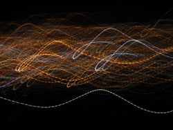 City lights viewed in a motion blurred exposure. The AC blinking causes the lines to be dotted rather than continuous.