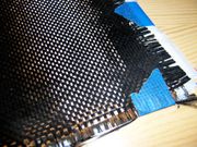Composite cloth consisting of woven carbon fiber.