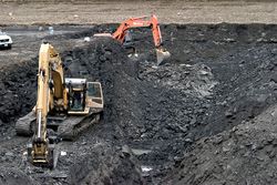 Korite International's mechanized mining operations are fairly basic, involving the excavation of shallow pits with backhoes.