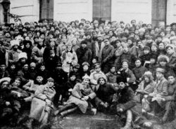Members of the Red Army gather around Vladimir Lenin and Leon Trotsky in Petrograd.