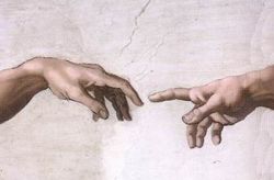 The iconic image of the Hand of God giving life to Adam.