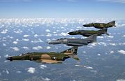 A formation of F-4 Phantom II fighter aircraft fly in formation during a heritage flight demonstration to commemorate the 50th Anniversary of the U.S. Air Force.