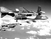 A flight of USAF F-4Cs refuel from a KC-135 tanker before making a strike against targets in North Vietnam. The Phantoms are fully loaded with 750-pound general purpose bombs, Sparrow missiles and external fuel tanks.