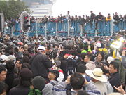 Protestors clashing with Hong Kong police in Wan Chai (area of Waterfront) during the WTO Ministerial Conference of 2005.
