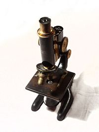 A 1915 Bausch and Lomb Optical microscope.
