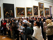 Crowd in front of Mona Lisa at the Louvre. Visitors generally spend about 15 seconds viewing the Mona Lisa.