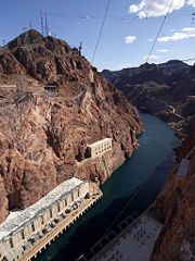 Downstream from Hoover Dam, showing the river, power stations, and power lines.