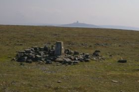 The summit of Cross Fell with Great Dun Fell in the background.The object in the centre is a "triangulation point", used for mapping in the pre-satellite era. It is approx 1 metre high