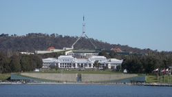 Three of Canberra's best-known landmarks, Lake Burley Griffin (foreground), Old and New Parliament House