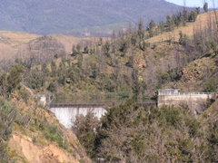 The Cotter Dam in December 2005, surrounding country still showing the effects of the 2003 bushfires.