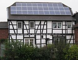 Timber framed house with a photovoltaic array