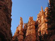 Hoodoos can form strange shapes due to random fluctuations in erosion patterns and variations between the rock strata.