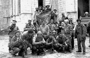 Members of the Armenian "Dashnak battalion" celebrate the capture of Shusha in front of Ghazanchetsots Cathedral.