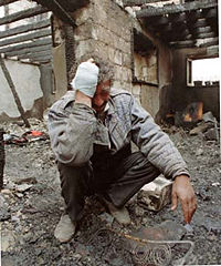 An Azeri man weeping in the ruins of a home in Agdam after an Armenian artillery bombardment.