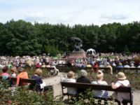 Sunday concert at Chopin statue.  White canopy (right) shelters pianist.