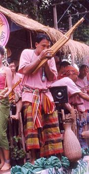 A khene player wearing an Isan men's sarong and pakama