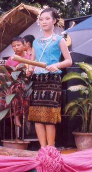 A musician wearing an Isan women's sarong