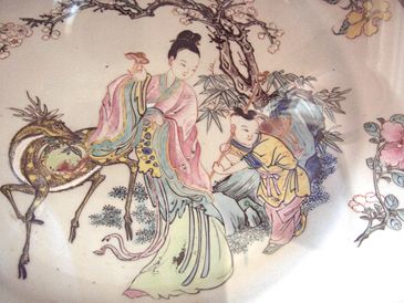 Xi Wang Mu ("Godmother of the West"), a Daoist deity, decor on a Qing dynasty porcelain plate, famille-rose style, Yongzheng Emperor period, 1725 AD.