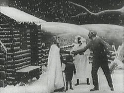 Still from Edwin S. Porter's 1903 version of Uncle Tom's Cabin, which was one of the first "full length" movies. The still shows Eliza telling Uncle Tom that she has been sold and that she is running away to save her child.