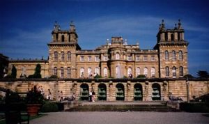 The West facade of Blenheim Palace ("Vanbrugh's castle air") shows the unique severe towering stone belvederes ornamenting the skyline.