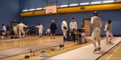 Fencing Tournament. (Note the grounded conductive strips on the floor.)