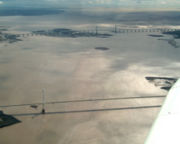 Aerial view of both Severn Bridges. The older bridge is in the foreground.