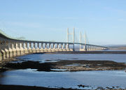 The Second Severn crossing, seen here from the English side of the river, carries the M4 motorway between England and Wales. The shipping channel lies between the two towers
