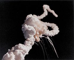 The iconic image of Space Shuttle Challenger's smoke plume after its breakup 73 seconds after launch. The accident caused the deaths of all seven crew members of the STS-51-L mission.