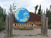 A sign along the Dalton Highway marking the location of the Arctic Circle in Alaska.