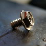Combination flanged-hex/Phillips-head screw used in computers