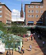 Coventry precinct with spire of ruined cathedral in the background.