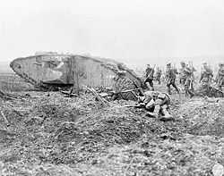 Canadian soldiers advancing behind a tank at the Battle of Vimy Ridge, one of Canada's greatest military victories.