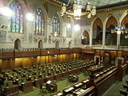 The Chamber of the House of Commons is decorated in green, and that of the Senate in red, following the tradition of the British Parliament.