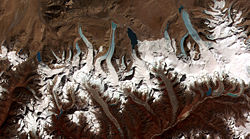 This image shows the termini of the glaciers in the Bhutan-Himalaya. Glacial lakes have been forming rapidly on the surface of the debris-covered glaciers in this region during the last few decades.