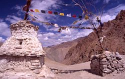 Pass in Ladakh with the typical Buddhist prayerflags and chorten