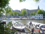 Tourist boats, also known as canal-bus, in Amsterdam, the Netherlands