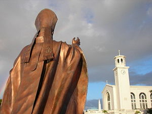 Dulce Nombre de Maria Cathedral Basilica in Hagatna, faced by a statue of Pope John Paul II. Roman Catholicism is the main religion in Guam.