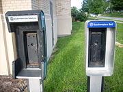 Empty AT&T payphone booths in Kansas City, KS.