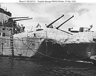 The light cruiser HMAS Hobart showing torpedo damage inflicted by a Japanese submarine on July 20, 1943. Hobart did not return to service until December 1944.
