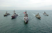 HMAS Anzac and HMAS Darwin with United States and British warships in late 2002