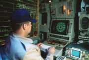 A crew member monitors the SLQ-32 radar warning system console aboard the battleship USS Iowa