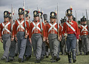 Reenacters of the 33rd Regiment of Foot Wellingtons Redcoats who fought in the Napoleonic Wars, 1812 – 1815, here showing the standard line 8th Company