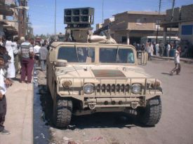 U.S. forces distribute information on the streets of Kut, Iraq