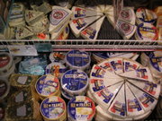 A supermarket display of cheese.