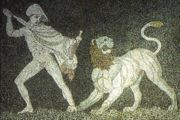Alexander fighting a lion with his friend Craterus (detail). He wears a chlamys cape, and a petasus hat. 3rd century B.C. mosaic, Pella museum.