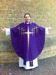 An Anglican priest in Eucharistic vestments. Anglican clergy usually vest at the Eucharist. While the chasuble is considered to be more "high church" by some Anglicans, the alb and stole are common vesture.