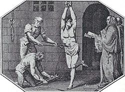 Two priests ask a heretic to repent as torture is administered.