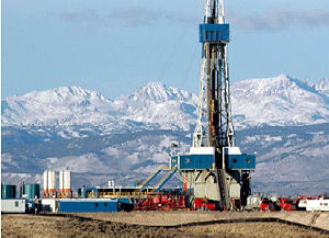 A Drilling rig drills for Natural Gas just west of the Wind River Range in the Wyoming Rockies